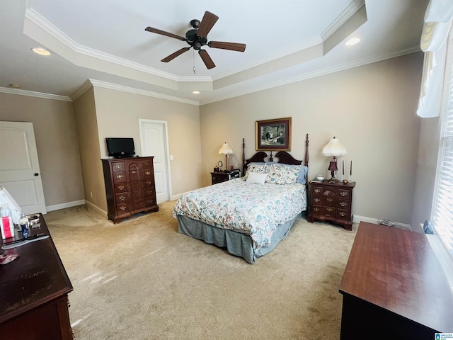 bedroom with light carpet, a raised ceiling, and crown molding