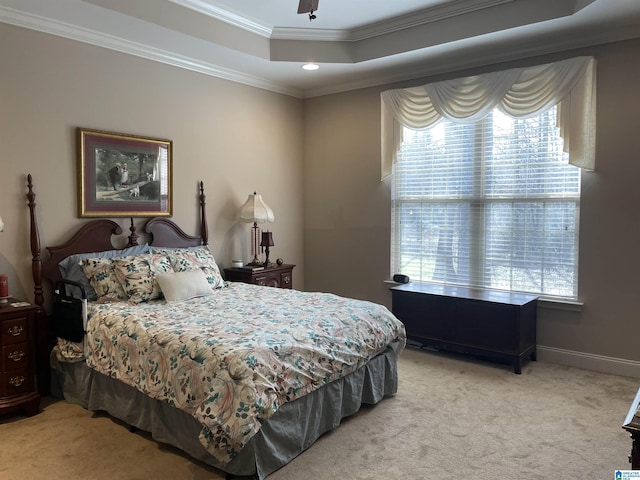 bedroom featuring baseboards, a raised ceiling, light colored carpet, crown molding, and recessed lighting