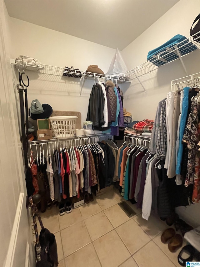 walk in closet featuring tile patterned floors