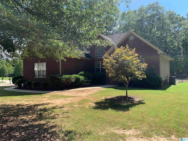 view of front of home featuring central AC and a front lawn