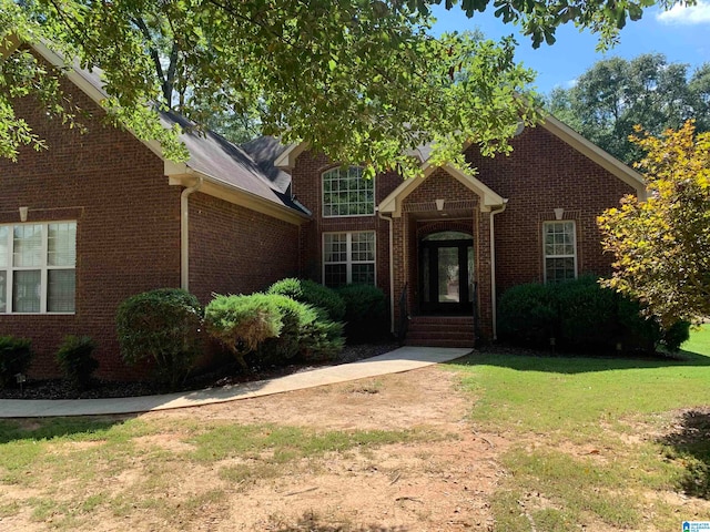 view of property featuring a front yard