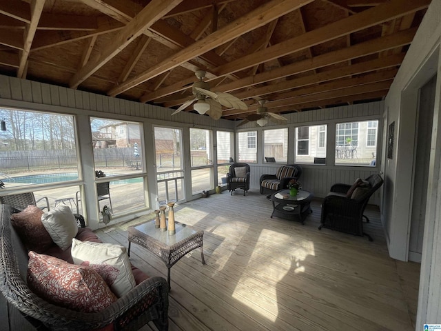 sunroom with lofted ceiling and plenty of natural light