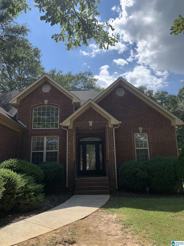 view of front of house featuring brick siding