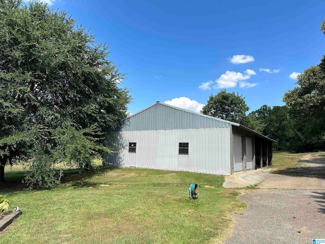 view of outbuilding with a lawn