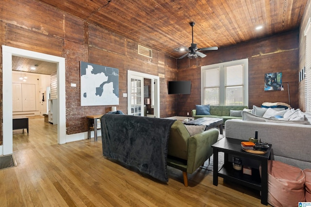 living room with wood ceiling, ceiling fan, and hardwood / wood-style floors