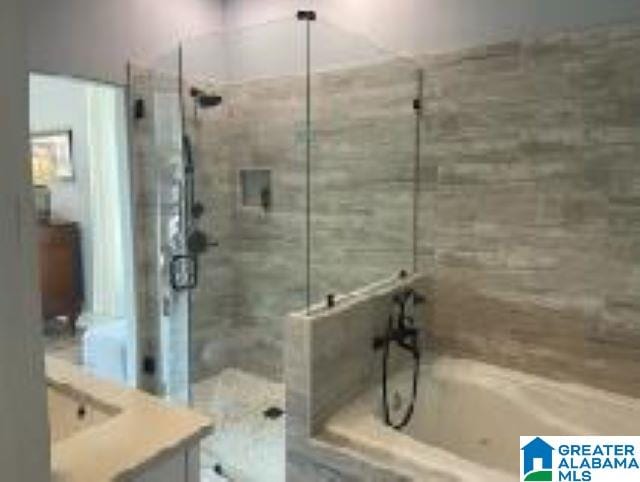 bathroom with shower with separate bathtub