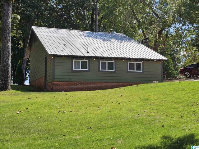 view of property exterior featuring a lawn