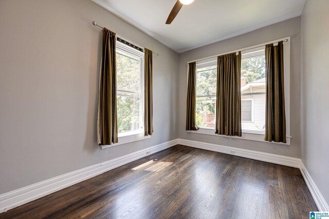 unfurnished room with ceiling fan and hardwood / wood-style floors