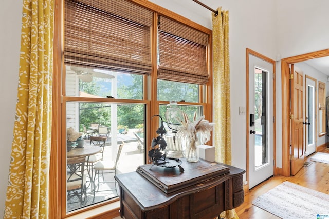 home office with a wealth of natural light and light wood-type flooring