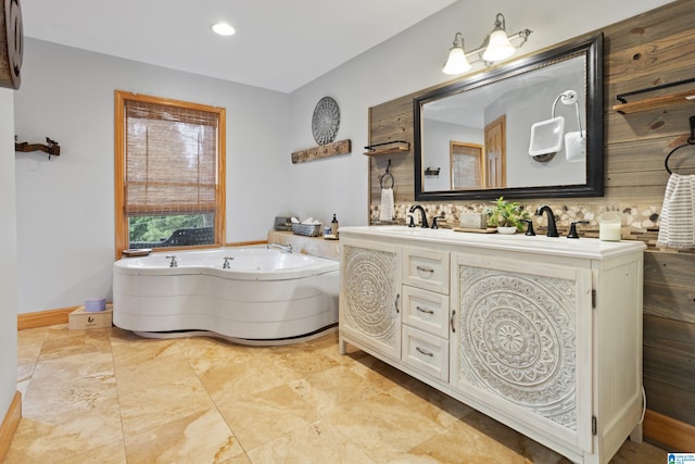 bathroom with backsplash, tile patterned flooring, a tub, and vanity