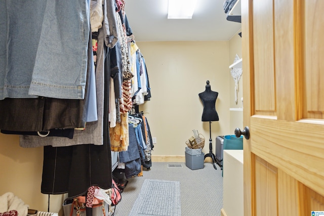 spacious closet with carpet flooring