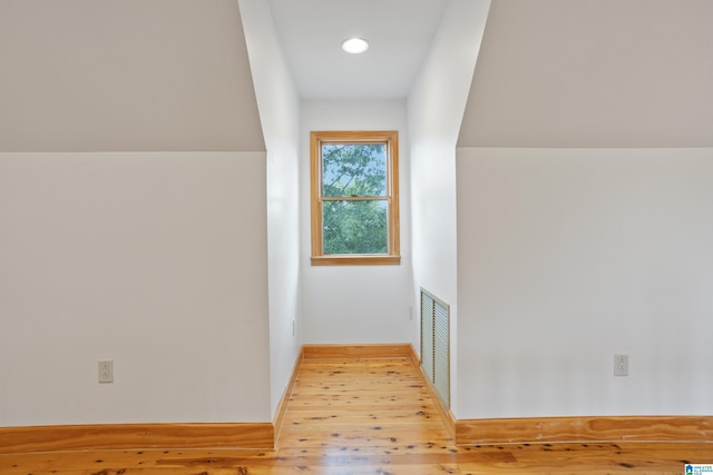 corridor with light wood-type flooring