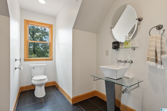 bathroom with sink, toilet, and tile patterned floors