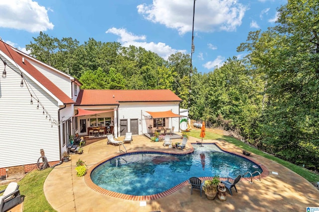 view of pool featuring a patio area