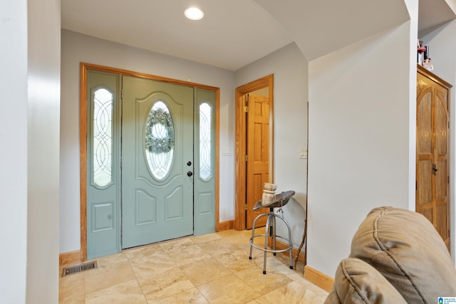 entryway with light tile patterned flooring