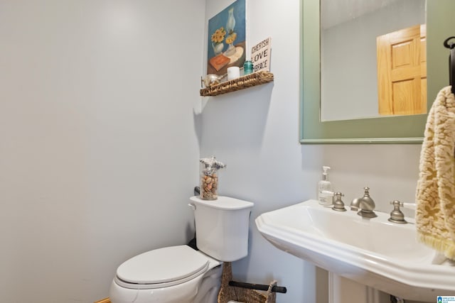 bathroom with sink and toilet