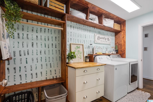 washroom featuring washing machine and dryer and dark hardwood / wood-style floors