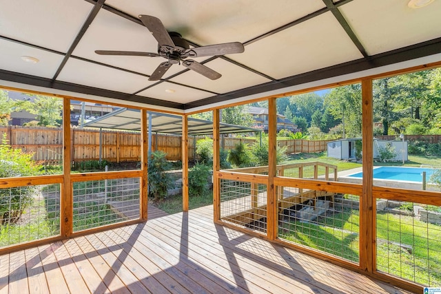 sunroom / solarium featuring ceiling fan