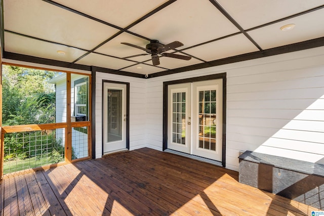 wooden deck with ceiling fan and french doors