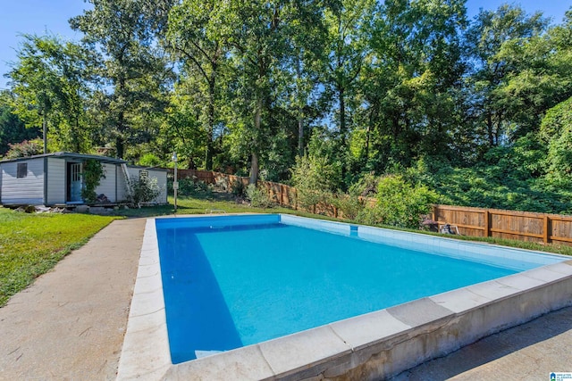 view of swimming pool with an outdoor structure