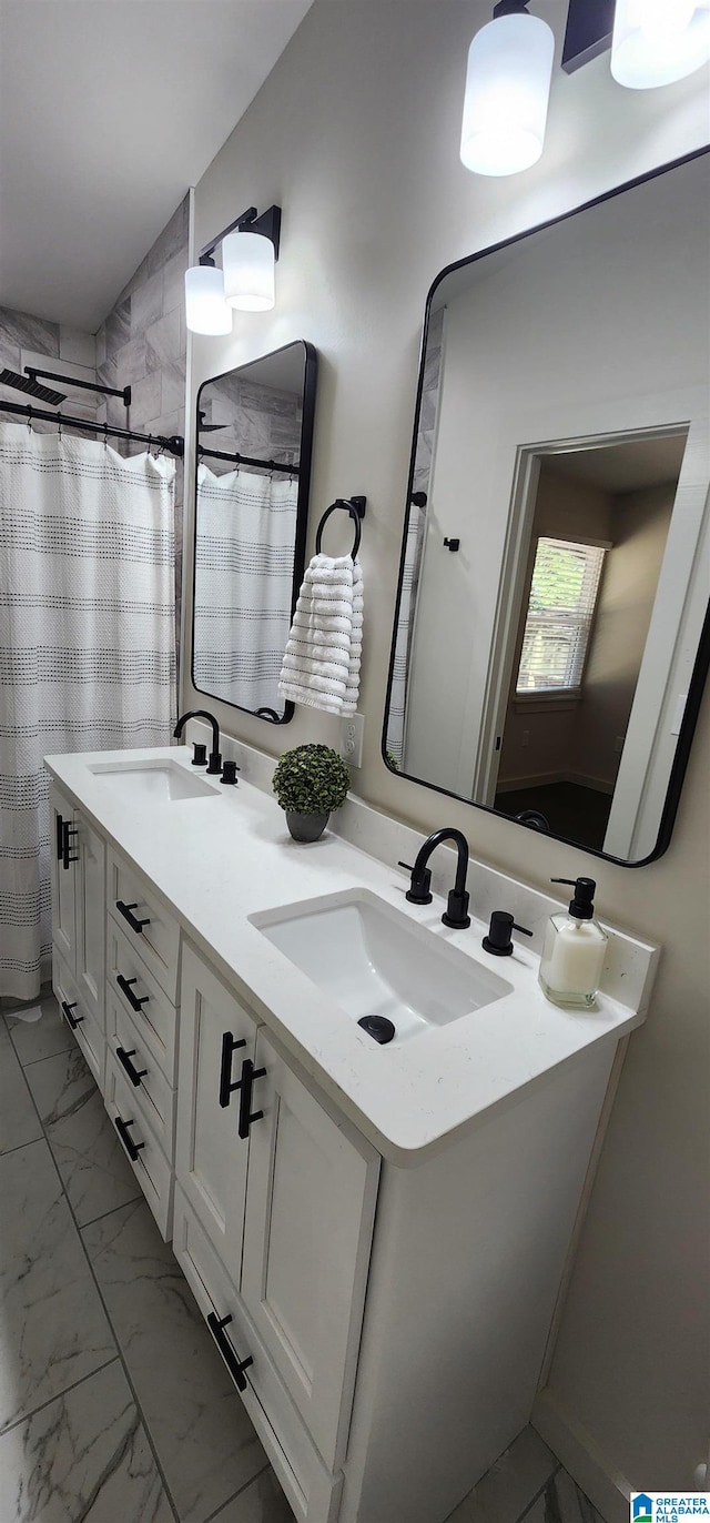 bathroom with a shower with shower curtain and vanity