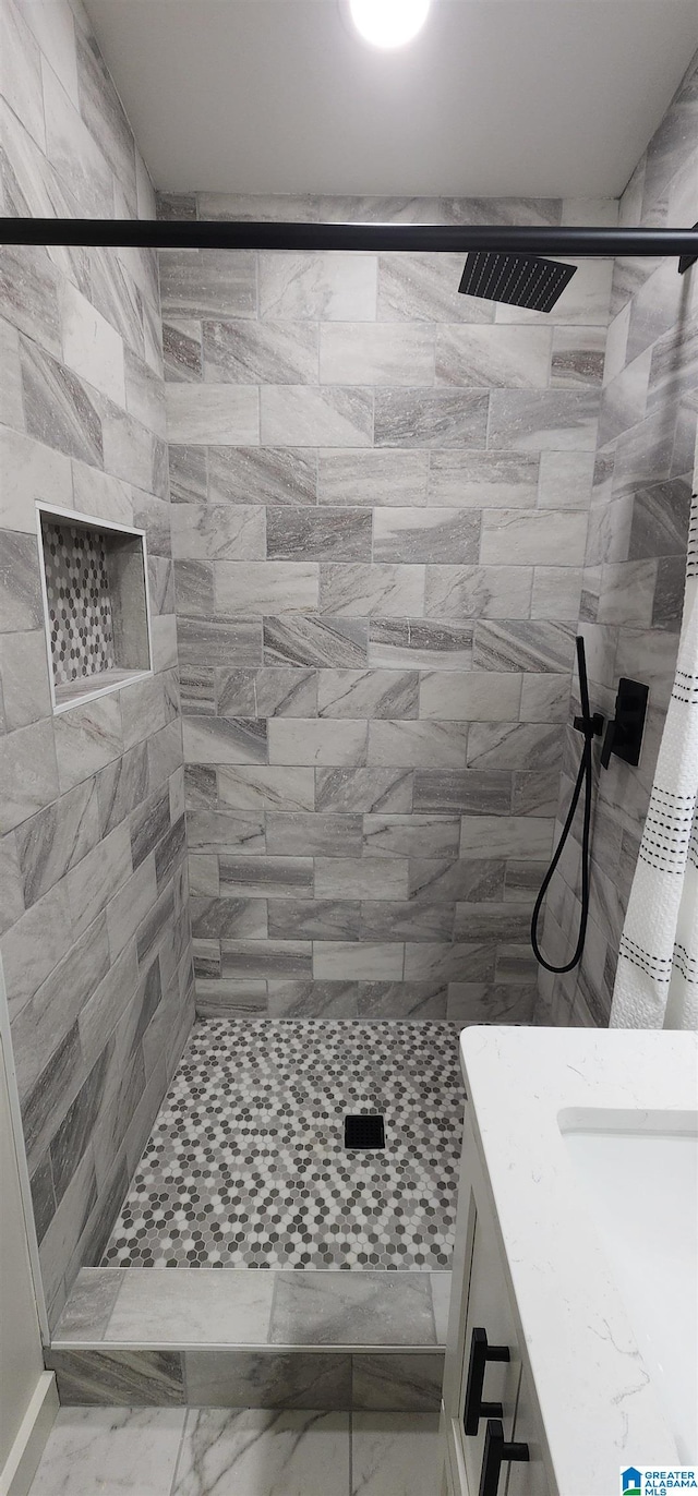 bathroom featuring vanity and walk in shower