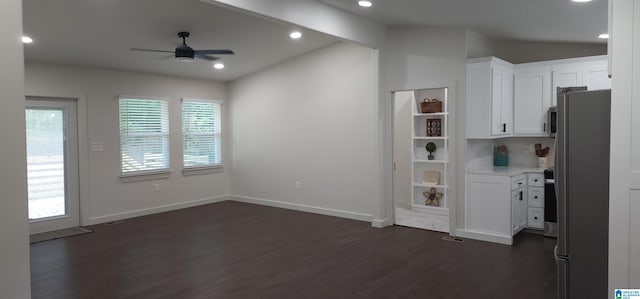 kitchen featuring ceiling fan, stainless steel refrigerator, dark hardwood / wood-style floors, and white cabinetry