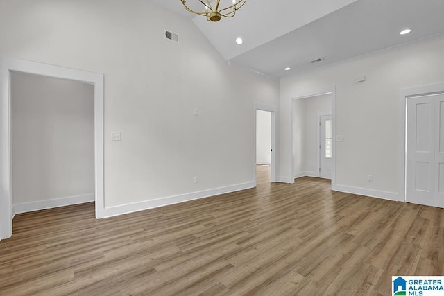 unfurnished living room featuring light wood-style floors, baseboards, and visible vents