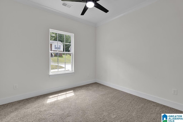 carpeted empty room featuring a ceiling fan, baseboards, visible vents, and crown molding