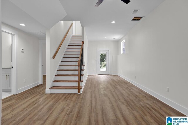 entryway with ceiling fan and light wood-type flooring