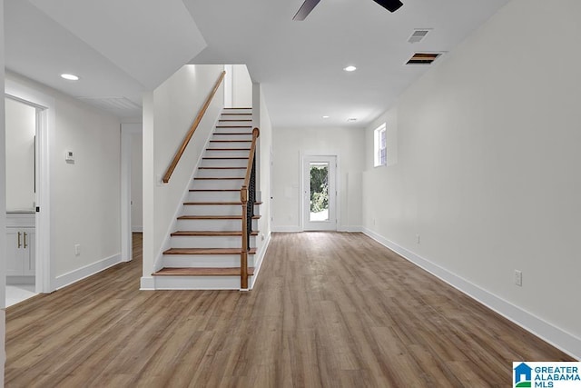 foyer entrance featuring light wood-type flooring, visible vents, and recessed lighting