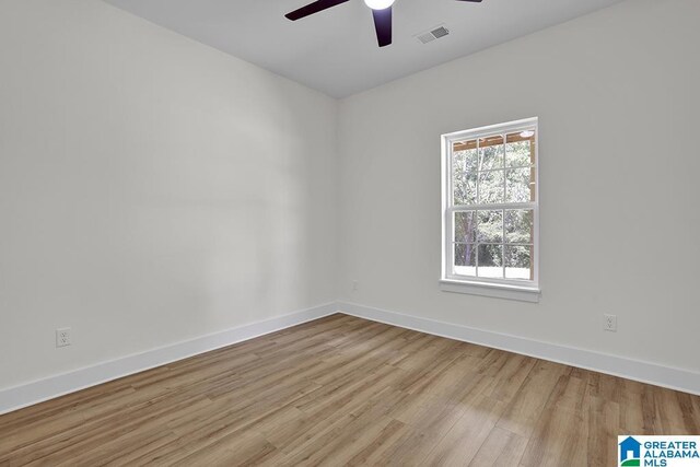 spare room featuring ceiling fan and light hardwood / wood-style floors