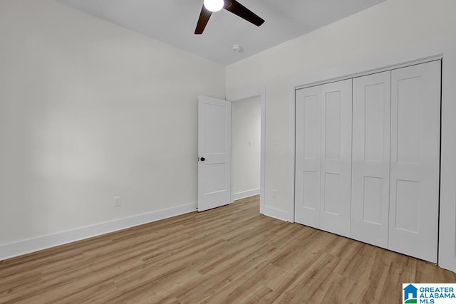 unfurnished bedroom featuring a closet, ceiling fan, and light wood-type flooring