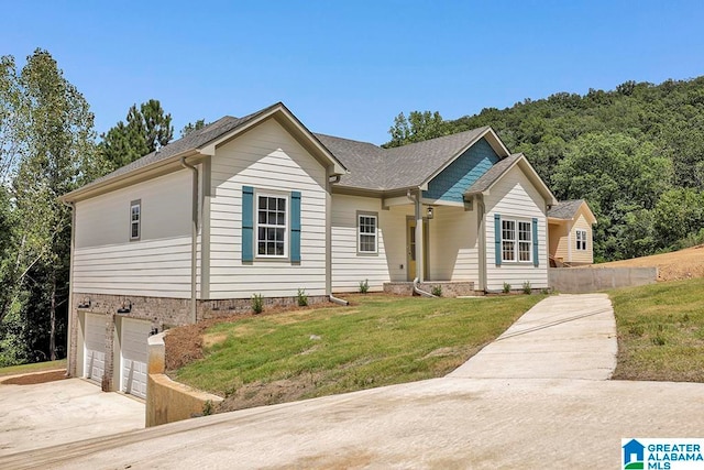 single story home with a garage and a front yard