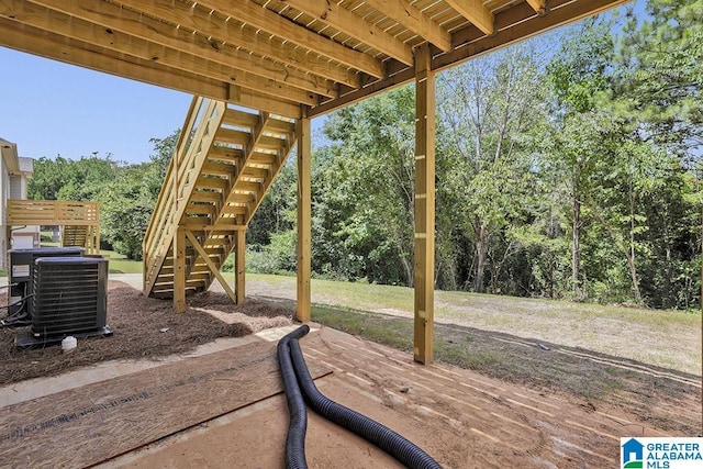 view of patio featuring central air condition unit and stairs