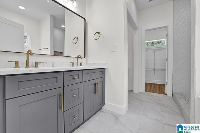 bathroom featuring tile patterned floors and double sink vanity