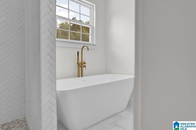 bathroom featuring a tile shower