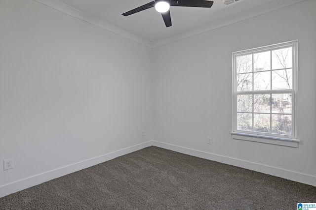 spare room with crown molding, ceiling fan, and carpet floors