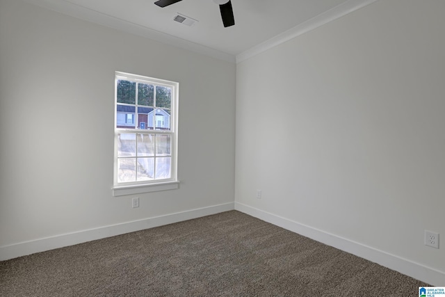 spare room featuring crown molding, ceiling fan, and carpet