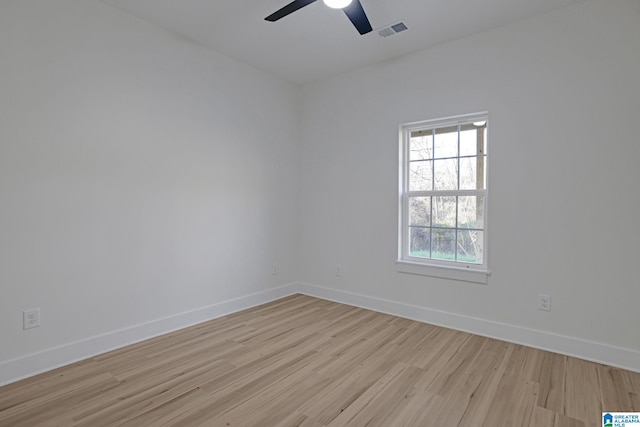 unfurnished room with ceiling fan and light wood-type flooring