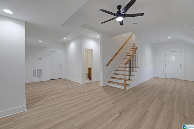 unfurnished living room featuring light hardwood / wood-style flooring and ceiling fan