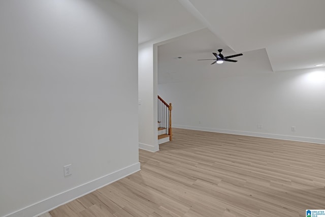 spare room featuring light hardwood / wood-style flooring and ceiling fan