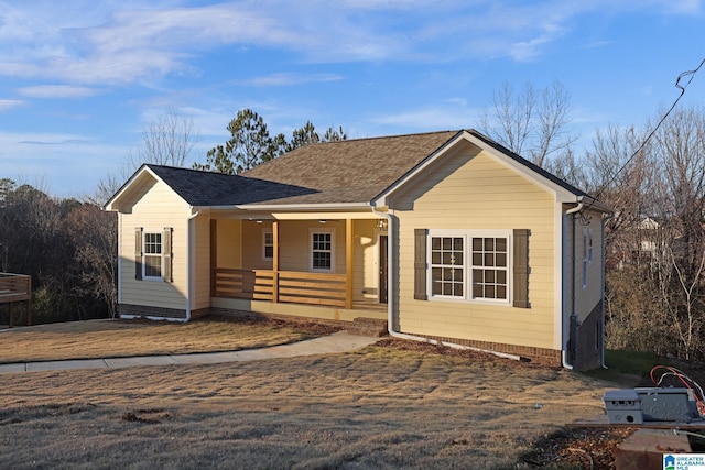 ranch-style house featuring covered porch