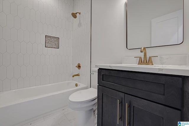 full bathroom featuring vanity, toilet, and tiled shower / bath