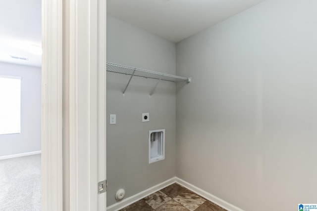 laundry area featuring tile patterned floors and electric dryer hookup