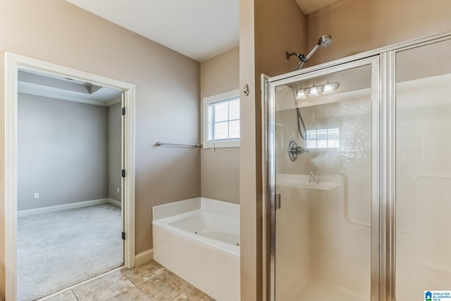 bathroom with tile patterned floors and independent shower and bath