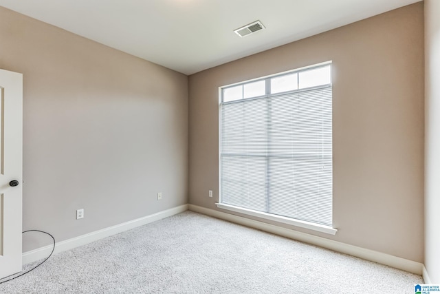 unfurnished room with carpet flooring