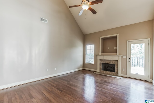 unfurnished living room featuring hardwood / wood-style floors, plenty of natural light, and a fireplace