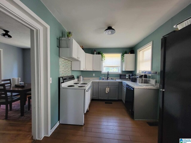 448 Roberts St, Wadley, AL 36276 - kitchen featuring black appliances, a sink, dark wood finished floors, and light countertops