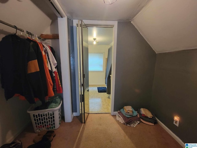 bonus room featuring carpet floors and vaulted ceiling